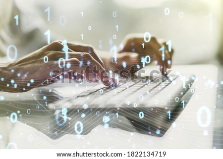 Creative abstract binary code hologram and hands typing on computer keyboard on background, AI and machine learning concept. Multiexposure