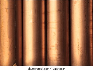 Creative abstract heavy non-ferrous metallurgical industry and industrial manufacturing business production concept: heap of background shiny metal copper pipes with selective focus effect