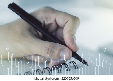 Creative Abstract Micro Chip Hologram And Man Hand Writing In Diary On Background, Artificial Intelligence And Machine Learning Concept. Multi Exposure