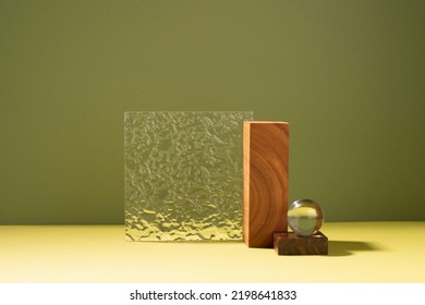 Creative abstract podium made of wooden figures and glass, dark green background hard light shadow - Shutterstock ID 2198641833