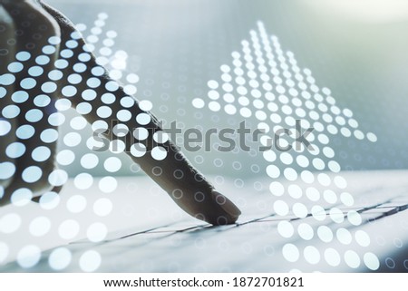 Creative abstract upward arrows hologram and hands typing on computer keyboard on background, leadership and motivation concept. Multiexposure
