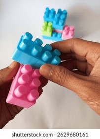 creative activity of assembling colored lego toys