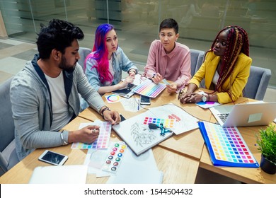 Creative Agency Designer Team Working Together:african American Woman With Dreadlocks Pigtails And Caucasian Girl Pink Blue Multi-colored Hair Communication With Indian Man In Office