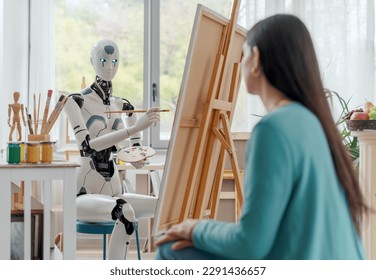 Creative AI robot painting a portrait on canvas in the art studio, a model is posing in the foreground