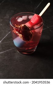 Creative American Patriotic Cocktail Lemonade With Pomegranate And A Red White And Blue Ice Pop