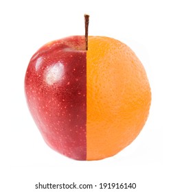 Creative apple combined from red apple and orange half isolated on white. Concept