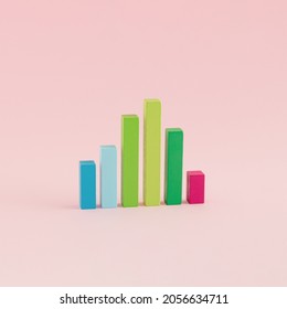 A Creative Arrangement Of Statistical Data Representation Made Of Wooden Cuboids On A Pink Background. Minimal Data Or Development Concept. Statistics, Analysis And Diagram Inspiration.