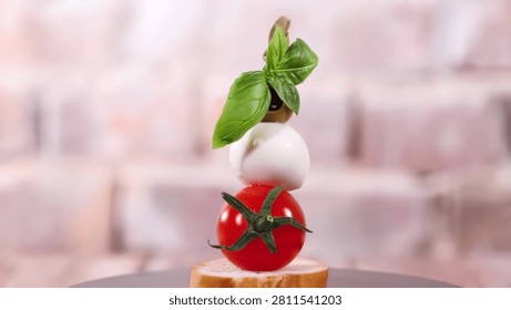 A creative arrangement of tomato, mozzarella, and basil on bread