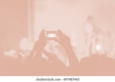 Creative Art Background. Hand With Smartphone Records Live Music Festival, Taking Photo Of Concert Stage Live Concert Luxury Party In Facebook Live. Smartphone Records Live Music Concert Festival