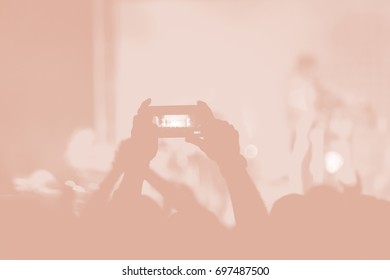 Creative Art Background. Hand With Smartphone Records Live Music Festival, Taking Photo Of Concert Stage Live Concert Luxury Party In Facebook Live. Smartphone Records Live Music Concert Festival