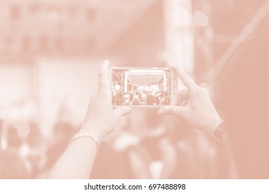 Creative Art Background. Hand With Smartphone Records Live Music Festival, Taking Photo Of Concert Stage Live Concert Luxury Party In Facebook Live. Smartphone Records Live Music Concert Festival. 