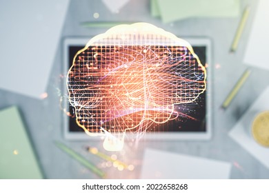 Creative artificial Intelligence concept with human brain sketch and modern digital tablet on desktop on background, top view. Double exposure