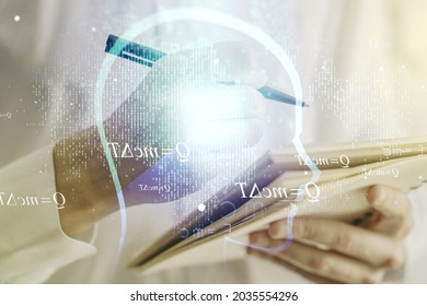 Creative artificial Intelligence concept with human head sketch and man hand writing in diary on background. Double exposure