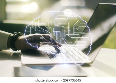 Creative artificial Intelligence concept with human brain sketch and hands typing on computer keyboard on background. Double exposure