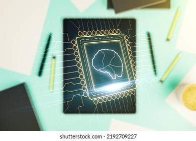 Creative artificial Intelligence concept with human brain sketch and modern digital tablet on desktop on background, top view. Double exposure