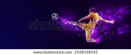 Creative artwork with male soccer, football player in motion with ball isolated on dark background with fluid neon elements. Concept of art, creativity, sport, energy and power