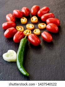 Creative assemblage of vegetables The Scarlet Flower on the black background - Shutterstock ID 1437540122