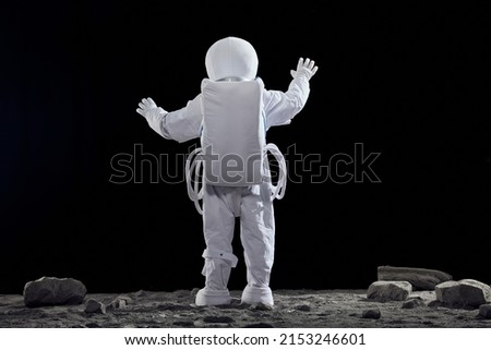 Creative astronaut back view. Welcome to space