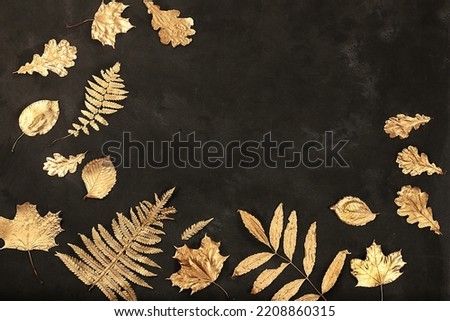 Creative autumn composition flat lay on seasonal background with golden maple leaves, minimal autumn concept, screen banner with place for text. Happy Thanksgiving and greeting card