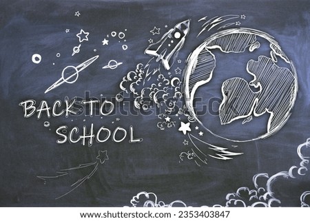 Creative back to school sketch with globe and rocket on blackboard wall backdrop. Education and knowledge concept