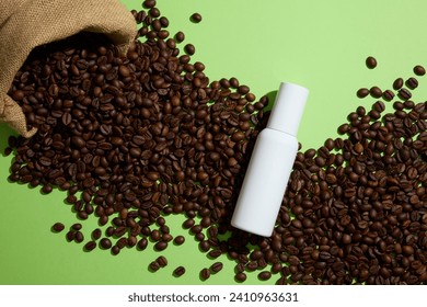 Creative background for advertising with white empty bottle displayed on coffee beans and green background. Top view. Coffee contains antioxidants that can help protect against UV ray - Powered by Shutterstock