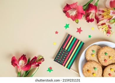Creative Background For Juneteenth Day With Black Liberation African American Flags, Tea Cakes Cookie And Bright Flowers