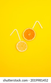 Creative Background With Lemon And Orange. Yellow Background. Juice Of Lemon And Orange. 