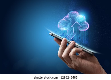 Creative background, male hand with the phone, the image of the hologram of the cloud, blue background. The concept of cloud technology, cloud storage, a new generation of networks. Mixed media.