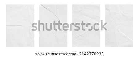 Creative background with scattered overlay of crumpled papers.