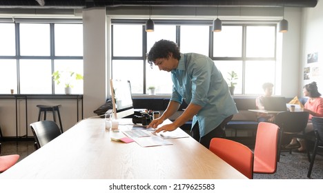 Creative Biracial Young Businessman Working At Computer Desk In Office. Unaltered, Creative Business, Workplace, Photography Themes.