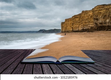 Creative book image of Beautiful sunset landscape image of Burton Bradstock golden cliffs in Dorest England