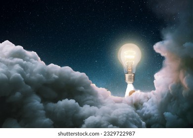 Creative burning light bulb rocket with blast and clouds of smoke successfully takes off into the starry sky. Creative idea, concept. Generation of new thoughts and ideas. Science and technology. Bulb