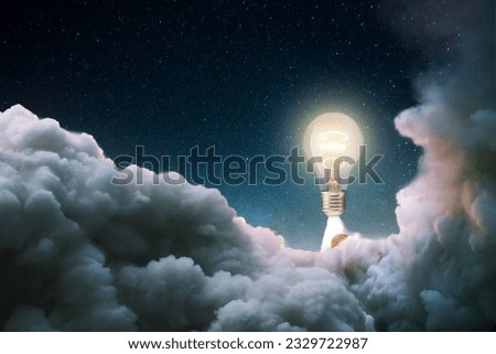Creative burning light bulb rocket with blast and clouds of smoke successfully takes off into the starry sky. Creative idea, concept. Generation of new thoughts and ideas. Science and technology. Bulb