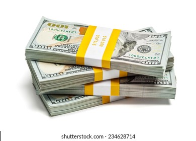 Creative business finance making money concept - stack of bundles of 100 US dollars 2013 edition banknotes (bills) isolated on white