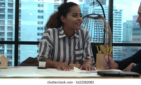 Creative business people group having conversation at office desk in modern workplace. Corporate international business concept. - Shutterstock ID 1622582083