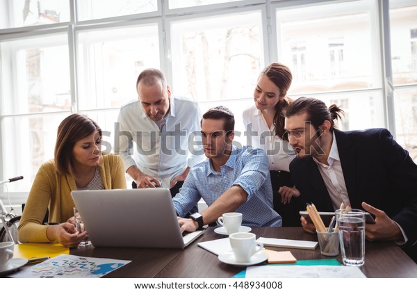 Creative Business People Looking Laptop Meeting Stock Photo