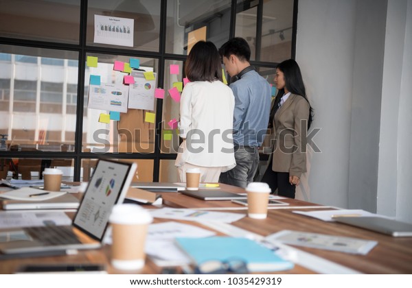 Creative Business People Putting Their Ideas Stock Photo