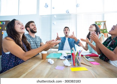 Creative Business People Throwing Paper In The Air At Office