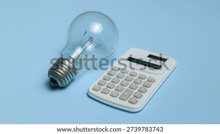 Creative Business Solution Concept with Light Bulb and White Calculator