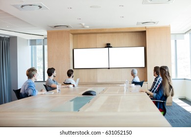 Creative Business Team Attending A Video Call In Conference Room At Office