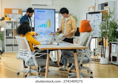 Creative business team presenting analytics dashboard in modern office meeting, teamwork communication, planning strategy, startup collaboration, corporate productivity.