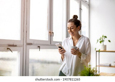 Creative business woman using smartphone in loft office
 - Powered by Shutterstock