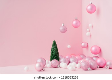 Creative Christmas design pink pastel color background with Christmas tree. New Year concept.
