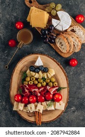 Creative Christmas Snack Tree On Dark Concrete Background. Cheese Plate. Christmas Food Concept. Top View