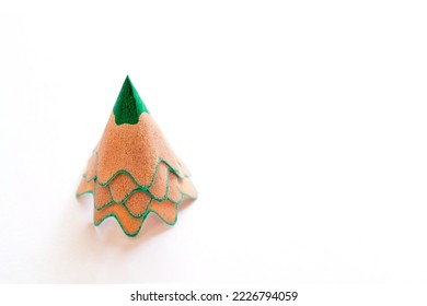 Creative Christmas tree made shavings from green pencil Christmas   New Year flat lay white background Copy space for text 