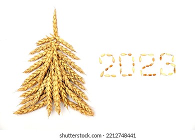 Creative Christmas tree made of wheat ears.New year 2023 made of grains on a black background.Creative New Year's flat lay. - Shutterstock ID 2212748441