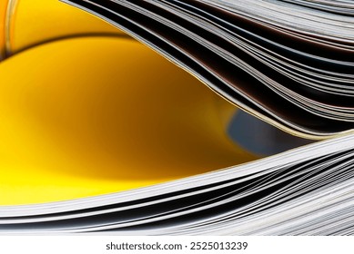 A creative close-up of a book showcasing dynamic curves and abstract lines, combining geometry and minimalism in a soft composition