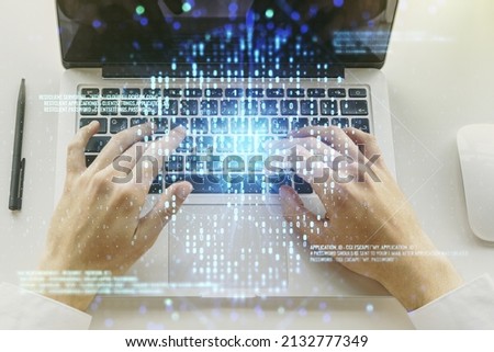 Creative code skull hologram and hands typing on computer keyboard on background, cybercrime and hacking concept. Multiexposure