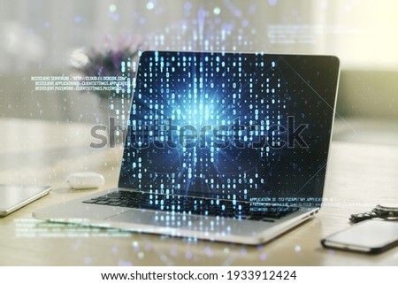Creative code skull hologram on modern computer background, cybercrime and hacking concept. Multiexposure