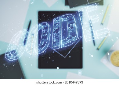 Creative Code word sign and modern digital tablet on desktop on background, top view, international software development concept. Multiexposure